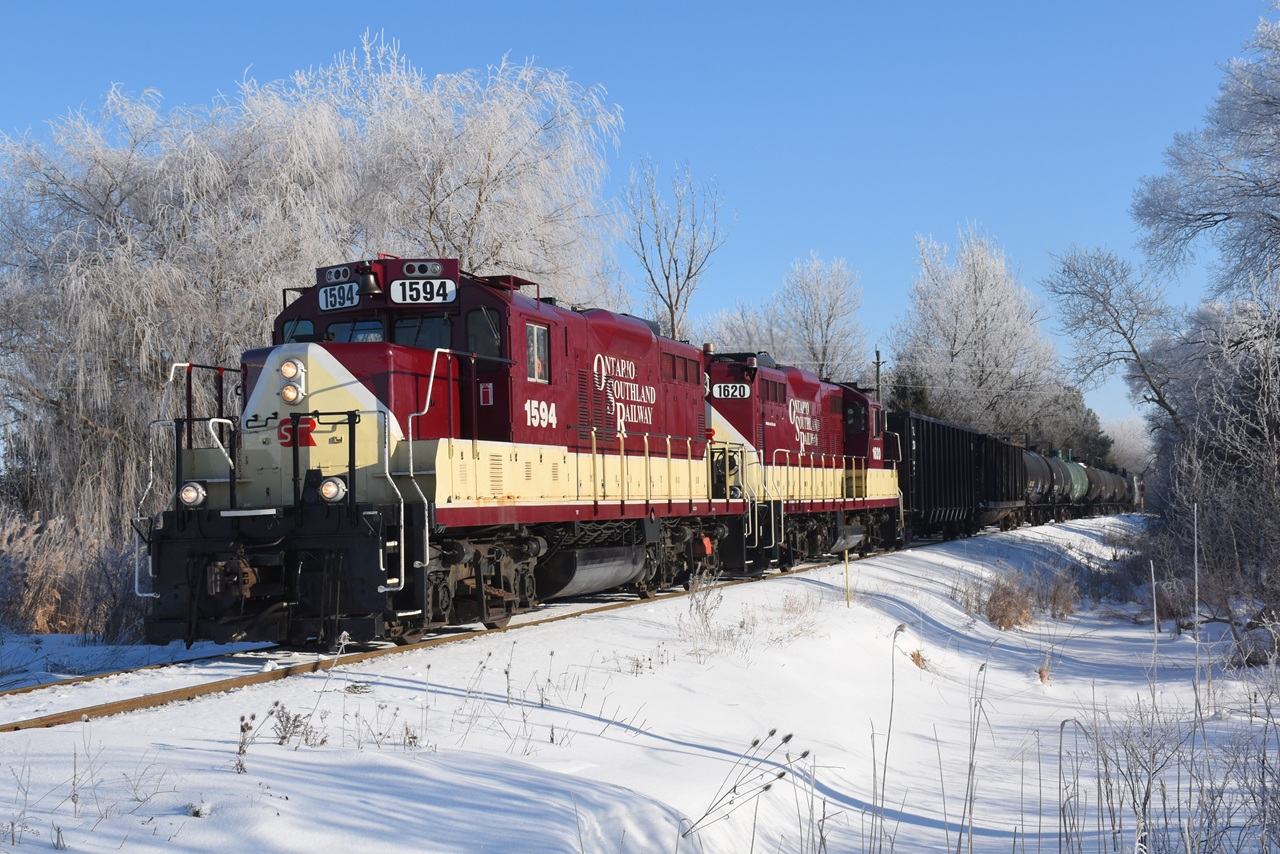 The OSR St. Thomas job passes through a winter landscape covered in hoar frost on the way to Putnam to work a few industries before continuing on to St. Thomas.