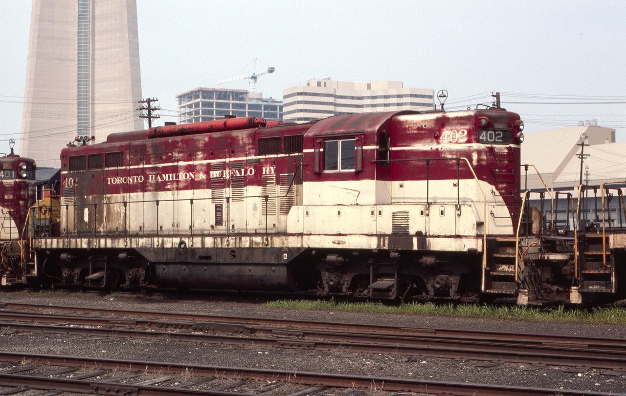 TH&B GP-9 #402 is seen near Toronto Union Station in August of 1985. The CN tower base proves this is a Toronto photo.