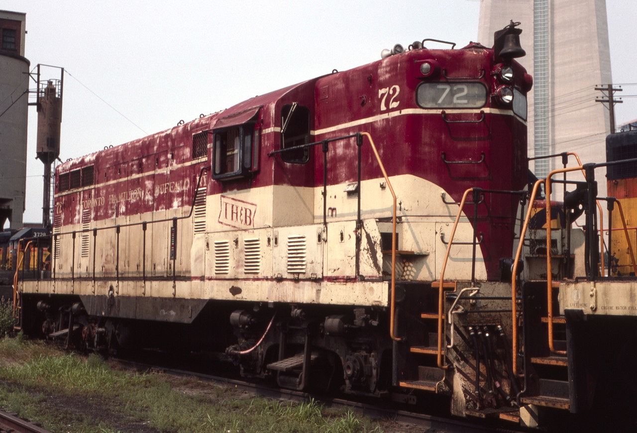 TH&B GP-7 #72 is seen near Toronto Union Station in August of 1985. Other Chessie and TH&B units were present that day. The base of the CN tower looms in the background.