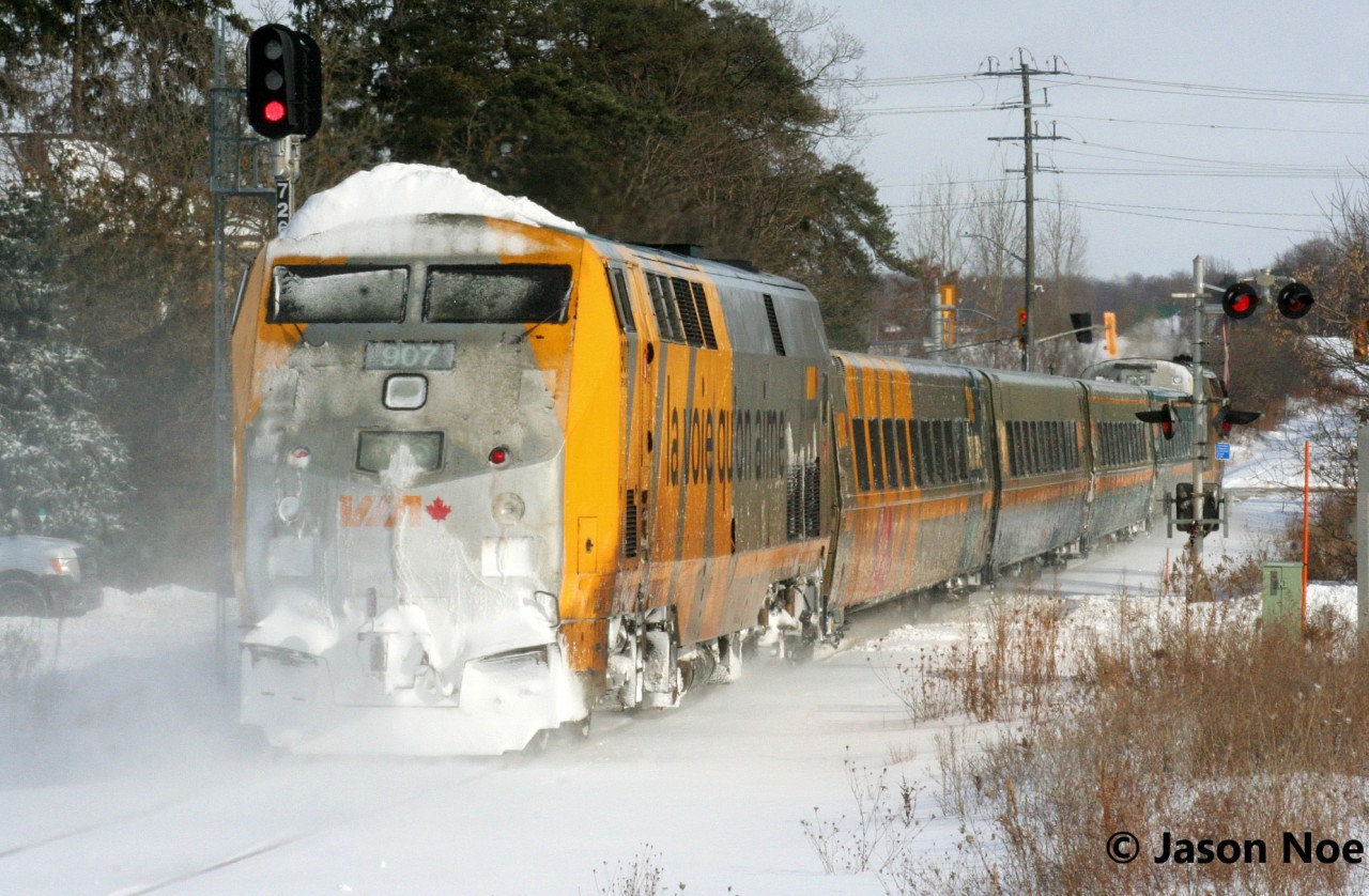 A frigid winter morning sees trailing VIA Rail P42 907 caked in snow as P42 909 leads train 84 through the town of Baden, Ontario on the CN Guelph Subdivision.