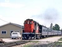 CN 3155 is westbound in Komoka, Ontario on August 13, 1982.