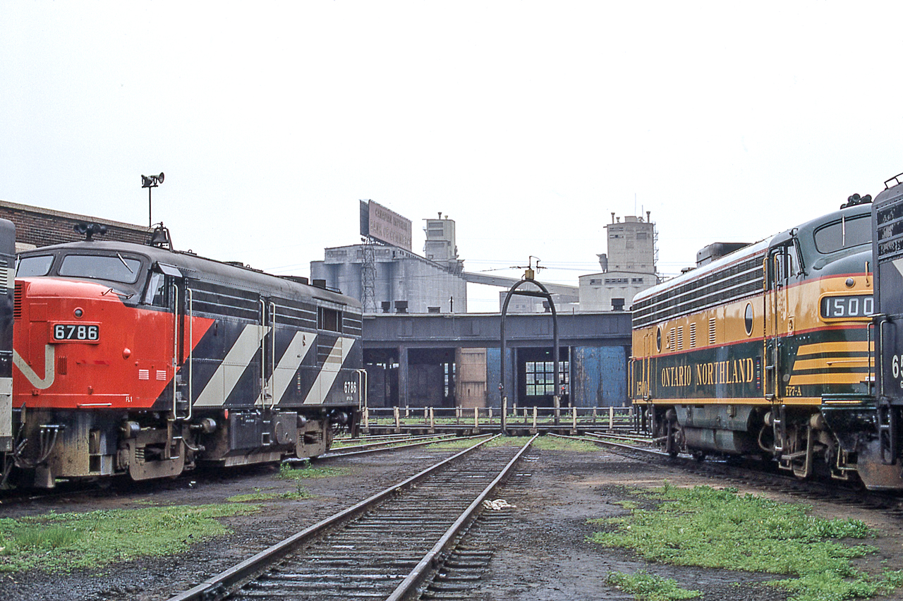 CN 6786 and Ontario Northland 1500 are bookends for the turntable at CN's Spadina engine facility in Toronto on June 13, 1972.