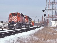 <br>
<br>
The Leaside Portfolio
<br>
<br>
CP Rail Extra 5738 West (note white markers & flags) with 5798 and a 8100 SW 'pup', on the approach to the Leaside crossover, March 2, 1980
<br>
<br>
Noteworthy: at that time the usage of ditch lights was at crew discretion 
<br>
<br>
At extreme left is the telephone box for the CN Leaside Branch crews to access the CP Rail Belleville Sub-Division
<br>
<br>
For CNoR Leaside details see:    
<br>
<br>
 <a href="http://www.railpictures.ca/?attachment_id=  45018">  CNoR Bridge  </a>
<br>
<br>
sdfourty

