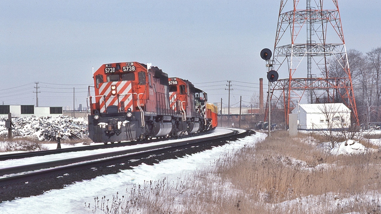 The Leaside Portfolio


CP Rail Extra 5738 West (note white markers & flags) with 5798 and a 8100 SW 'pup', on the approach to the Leaside crossover, March 2, 1980


Noteworthy: at that time the usage of ditch lights was at crew discretion 


At extreme left is the telephone box for the CN Leaside Branch crews to access the CP Rail Belleville Sub-Division


For CNoR Leaside details see:    


   CNoR Bridge  


sdfourty
