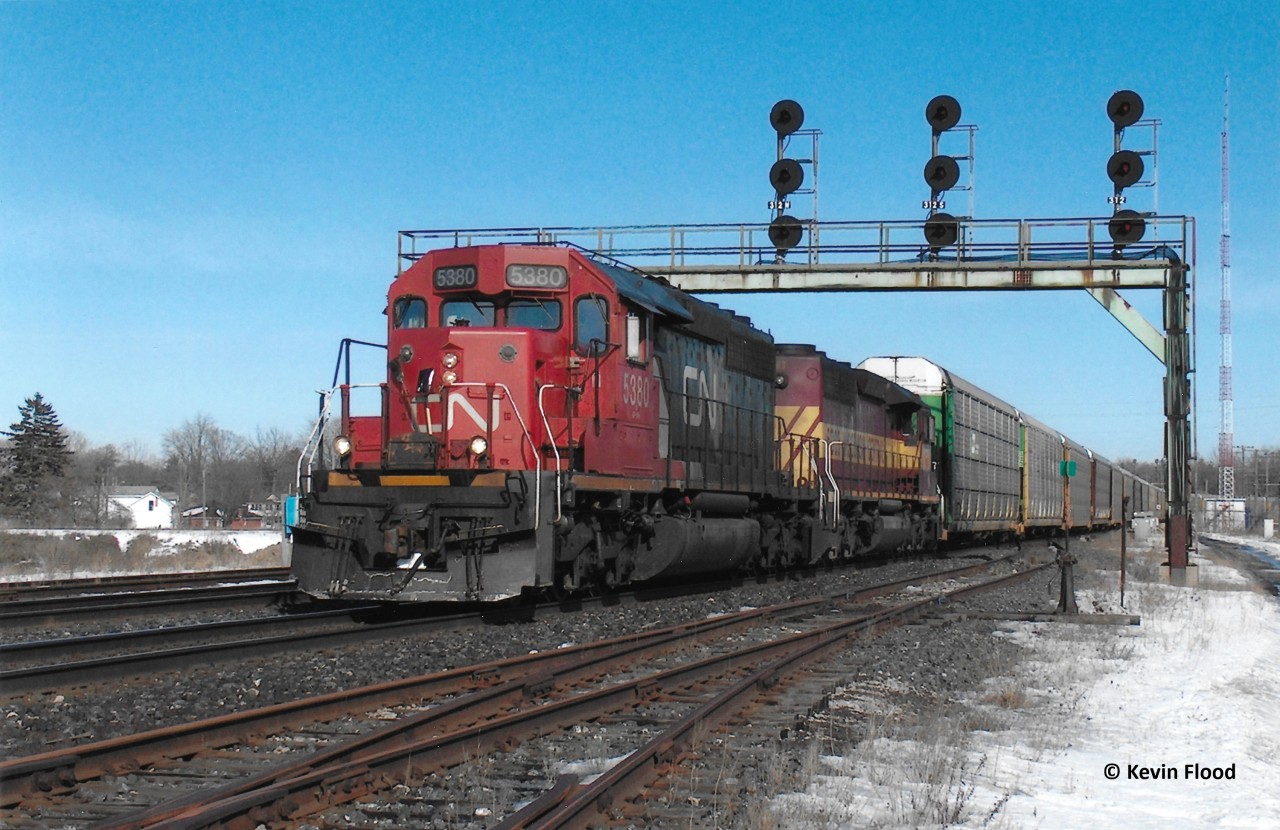 A westbound CN with CN 5380 in the lead and a Wisconsin Central unit trailing heads through Paris Jct. on a nice winter afternoon in 2007.