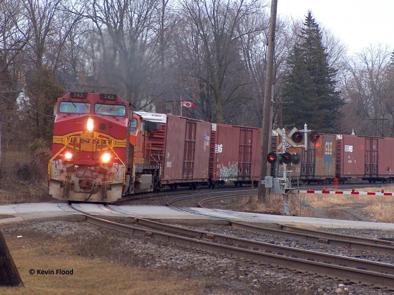 What I assume is a 390-series westbound, rounds the curve at Paris with two BNSF units, the leader in the so-called "fake bonnet" scheme (because of the BNSF lettering) and an H2 BNSF trailing. I would also shoot another train with a BNSF leader in a similar scheme the same day. During this time period, it was not uncommon to see BNSF power on CN trains.
