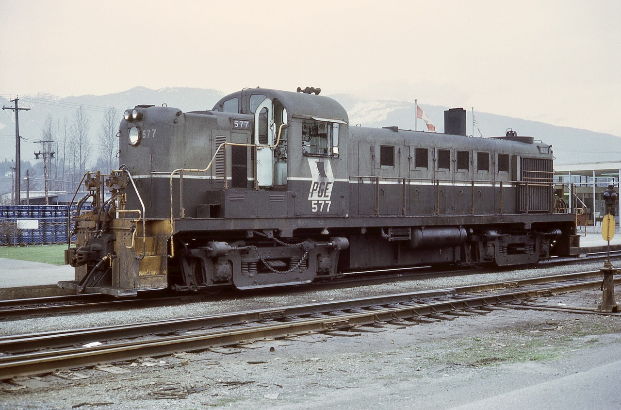 By my timing in life and railway photography, only a short period of Pacific Great Eastern was within reach, mostly from a few visits to North Vancouver yard by public transit from downtown Vancouver.  Thus this view of MLW RS-3 yard engine PGE 577 on a crew break at the PGE passenger depot at North Vancouver on Saturday 1972-01-22, just over two months before PGE became British Columbia Railway on 1972-04-01.

PGE 577 was rebuilt to slug BCOL 403 in 1984, and was retired by CN in 2006.