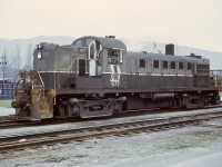 By my timing in life and railway photography, only a short period of Pacific Great Eastern was within reach, mostly from a few visits to North Vancouver yard by public transit from downtown Vancouver.  Thus this view of MLW RS-3 yard engine PGE 577 on a crew break at the PGE passenger depot at North Vancouver on Saturday 1972-01-22, just over two months before PGE became British Columbia Railway on 1972-04-01.

<p>PGE 577 was rebuilt to slug BCOL 403 in 1984, and was retired by CN in 2006.