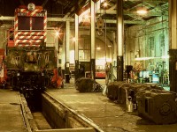 Hoisting a locomotive on jacks to allow a truck to be moved out for a traction motor change was a regular work procedure at the CP/E&N backshop in Victoria, but the pictured one of Baldwin CP 8001 on Saturday 1975-03-01 carries special significance.  Just ten days later came instructions to shut down all CP Baldwin roadswitchers (seven remaining of the original thirteen after various mishaps) after twenty-six years of being maintained in that shop, so 8001 was the last to ride those jacks.

<p>As a three-year employee there at that time, that hurt, and I often wondered what the longer-service folks (some of them well over half their careers) felt.