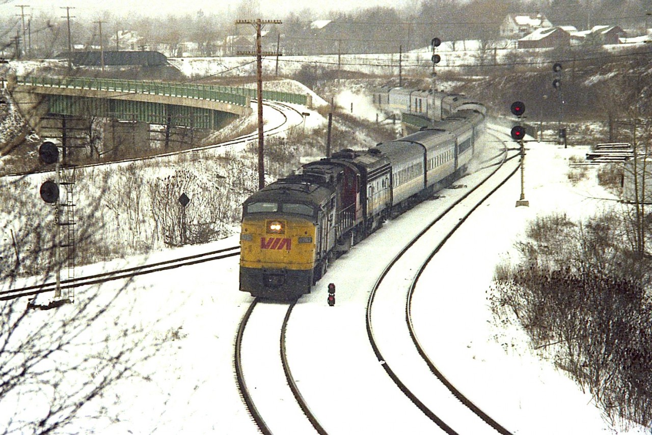 Not very often I shot off of this hillside in the winter. Reason, freezin'. One could really feel the north wind while hanging out in such a prone location.  Too bad, because often a good shot was to be had.  This one I liked: VIA 6782, CN 3126, VIA 6612 east.  Was this #72? Not sure. But in the short days of February I wager this is what it had to be.