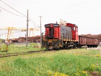 It was interesting news this January past when the switcher that worked the pulp and paper company in Iroquois Falls for so many years under Abitibi and eventually Resolute Forest Products, has now returned after a stint in Thorold South, last with Bioveld. Abitibi bought the unit from CN in 1993. Iroquois Falls mill closed in 2014 and the unit was relocated to Thorold.  Now, under great fanfare, it has returned to "The Falls" as the resident switcher for the new Abitibi Connex logistics hub, which has taken over the old pulp and paper lands.
The 14 mile line from Porquis Jct to Iroquois Falls has been upgraded and now in service.
The image I have posted shows the unit back in its earlier days as it comes up to a switch. Note the mass of logs in the background. The loss of the forest products business devastated the community and it is nice to see that life has returned by way of this new logistics company
I understand the 1305 sports a brand new attractive paint scheme, making a side trip while in the north this spring a worthwhile adventure.