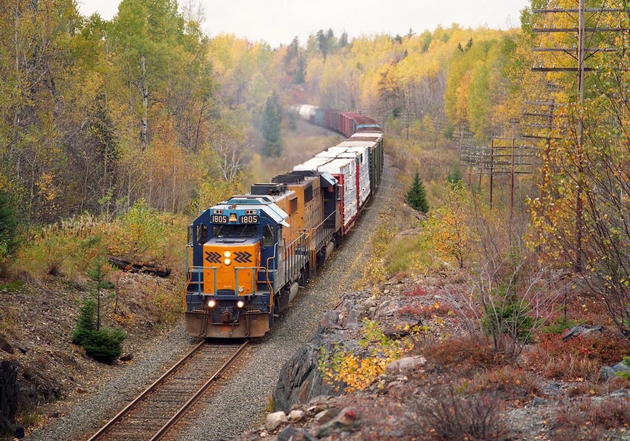 Colourful late fall day as ONR 1805, 1733 make their way south to Englehart as seen from the Hwy 112 overpass.