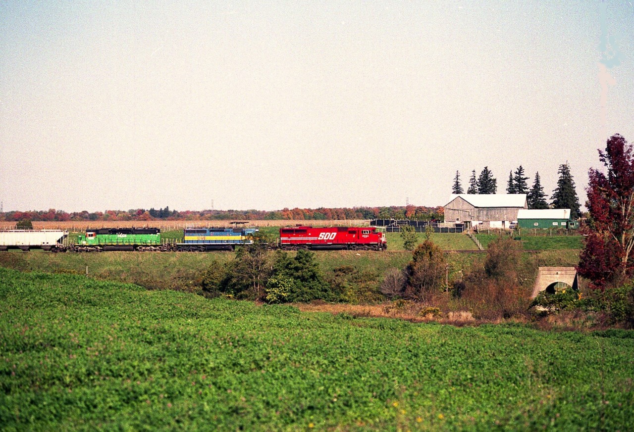 Beautiful fall afternoon to spend driving Hwy 2 parallel the CP line in hopes of catching a decent looking train or two.  Leasers were "the thing" back then, so it was nice to see a colourful eastbound just outside of Thamesford,  with SOO 6062 leading a DME and HLCX. About a year later the SOO SD60M would be renumbered to 6262.