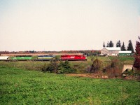 Beautiful fall afternoon to spend driving Hwy 2 parallel the CP line in hopes of catching a decent looking train or two.  Leasers were "the thing" back then, so it was nice to see a colourful eastbound just outside of Thamesford,  with SOO 6062 leading a DME and HLCX. About a year later the SOO SD60M would be renumbered to 6262.