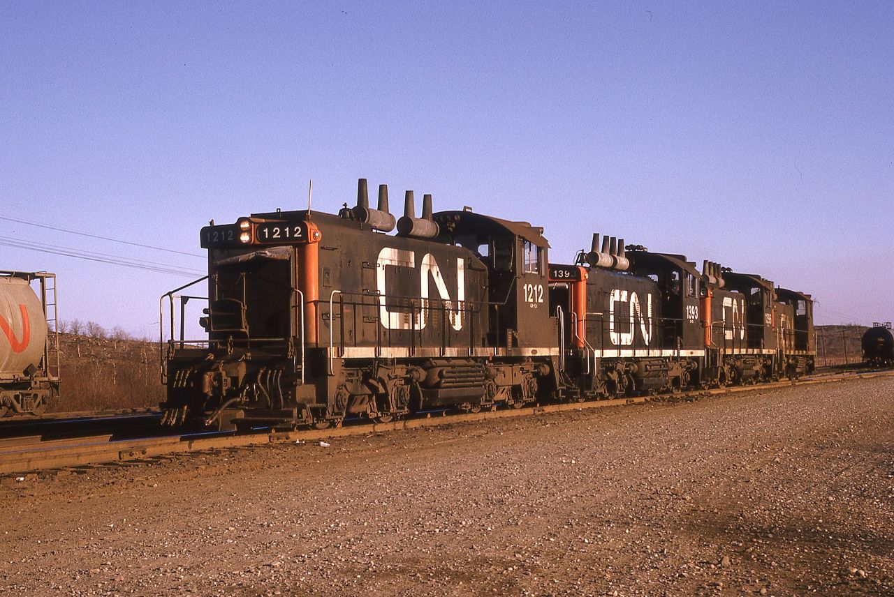 One of the Sudbury Yard jobs is backing into the "KEG" to retrieve cars set out by an earlier northbound.  Power this day was four SW1200RS units: 1212-1393-1396-1507.