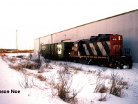 Just as the sun sets on a cold winter day, CN GP9RM 4101 is pictured setting-off one Burlington Northern boxcar at Commonwealth Plywood in north Waterloo, Ontario. Within a minute, the GP9RM would uncouple and then return light power to the Kitchener Yard on the Waterloo Spur. 
<br>
Here is a photo of the same train heading to Commonwealth Plywood in uptown Waterloo.
<br>

http://www.railpictures.ca/?attachment_id=58447

<br>

