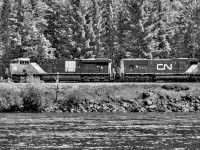 CN 3879 leads an intermodal train heading towards Jasper AB up the Clearwater Sub. Nice to catch an older SD75I trailing. Notice that the front door is open. oops... 