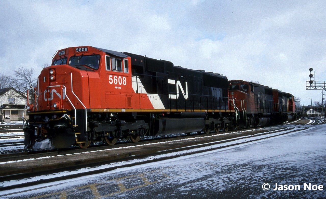 CN train 399 is seen at Brantford, Ontario on the Dundas Subdivision about to perform some work. The consist included; SD70I 5608, GP40-2L(W) 9477 and SD40-2(W) 5325. Just over five months prior, SD70I 5608 had rolled out of the GMDD plant in London during September 1995.