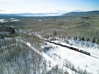 CN 2776 leads an LPG train north to Fort St. John. Note the haze in the air towards the mountains. 