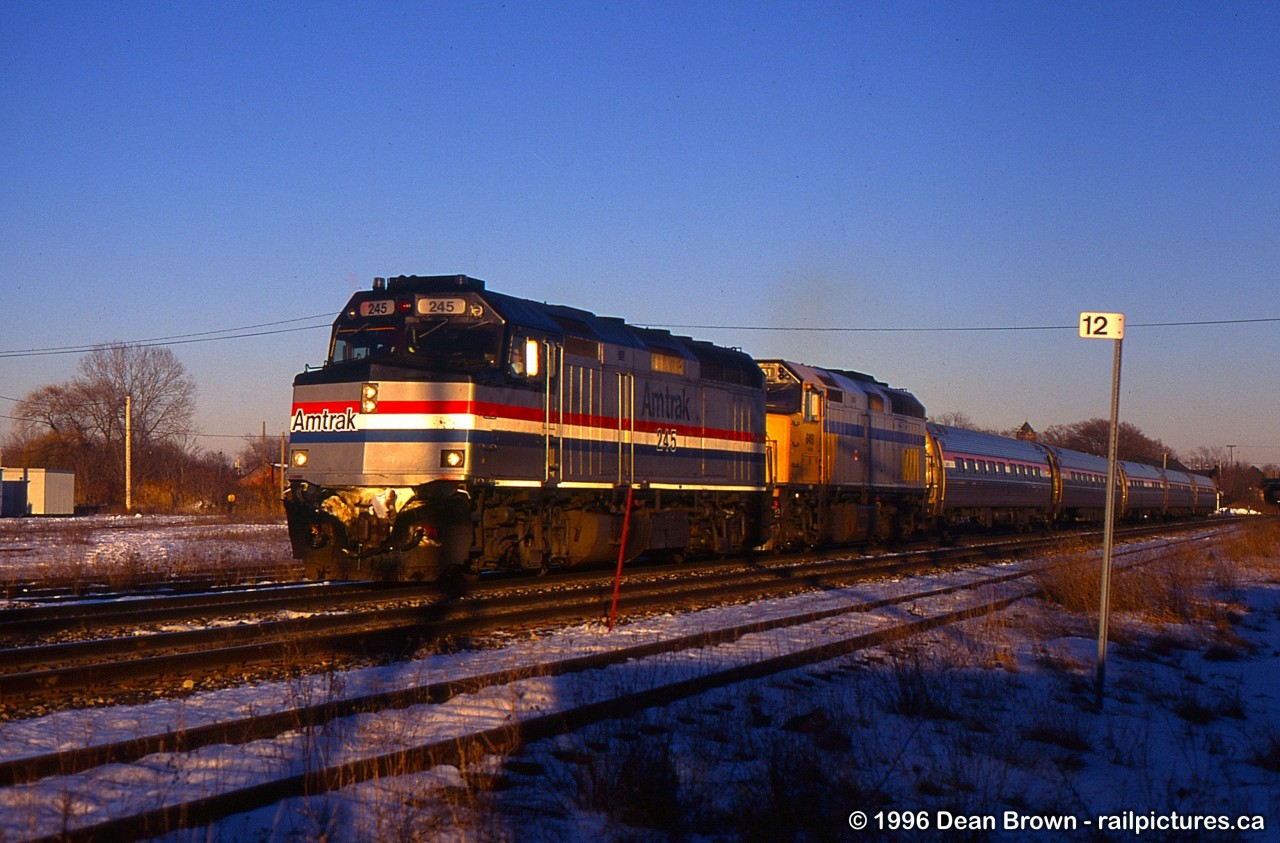 AMTK F40PH-2 245 and VIA F40PH-2 6451 lead 98 through St. Catharines.