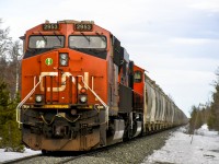 CN 2953 shoves a heavily loaded sand train up the steep grade to FSJ. Behind the locomotive is one of the new-of-the-time SD75IACCs that CN is having rebuilt from their SD75I fleet. 
