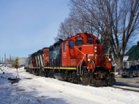 CN YRP002 has just lifted empties at Bitumar with CN 7272 & CN 4135. The track out of the client here parallels Montreal-Est Avenue.