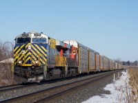 A late CN 271 is westbound through Baie-D'Urfé with CN 2766 & CN 2825.