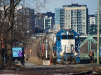 CN's East Side Canal Bank Spur is served by CN 500 a few times a week, generally quite early in the morning, which is not great in terms of sun angle. Last Friday CN 500 had power issues and left their power on the spur without having lifted empties from the one client left on the line (Ardent Mills). Later that day, CN 543 would lift CN 500's dead power and the afternoon PSC job (CN 596) would go lift the empties soon after that. Here CN 596 is heading back to the main line with seven cars and CN 4909. The crew has just flagged a crossing near Atwater market.