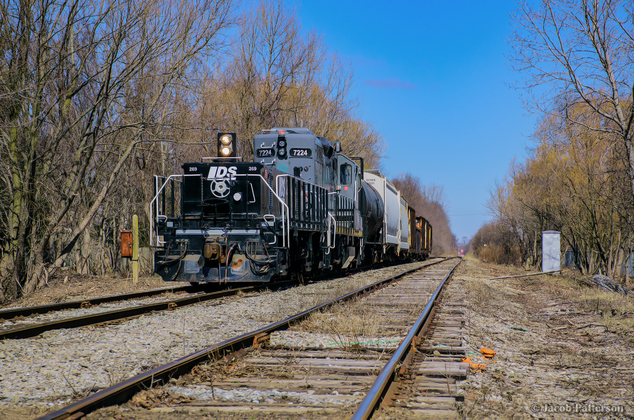 Tying back onto their train after working Vesuvius, GIO's Welland Job pauses on the former site of WX interlocking, where the Canada Southern Canada Division mainline once crossed the CNR Welland Sub, prior to the opening of the Welland Canal By-Pass project in 1973.

After knocking off the handbrakes, a brief switch at Verbio is in order before returning to Feeder.


1970: Southbound CN local
1971: facing west showing tower
1971: facing west from WX Tower
1971: facing east from diamond, Niagara Falls to left, Fort Erie to right
1972: C&O westbound at WX
Eastbound at WX
Meet at WX