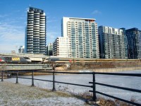 Inbound VIA 33 (at left) and outbound VIA 22 (at right) meet at Wellington. The surroundings are frosty after an ice storm.