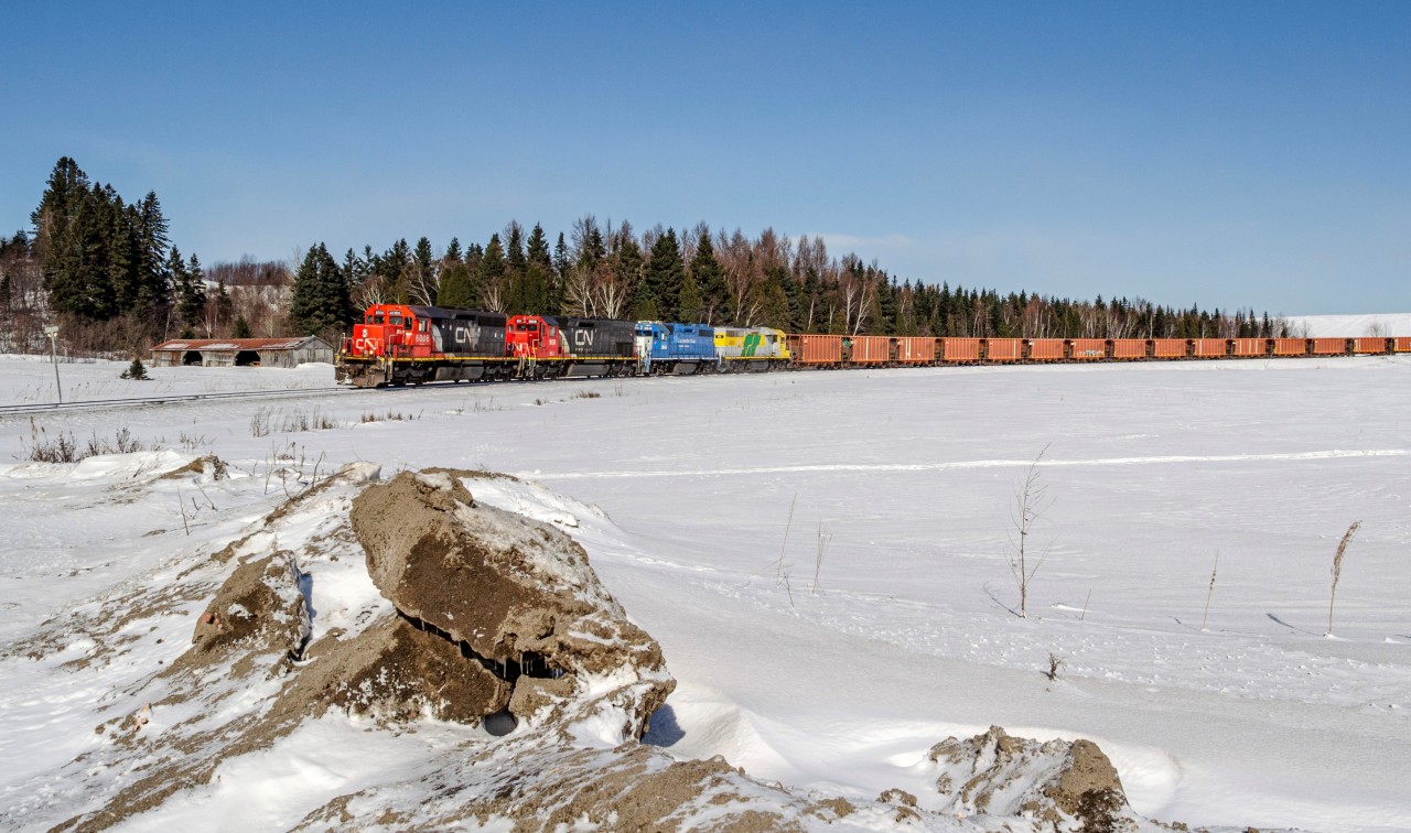 Two of the 3 CN SD40s recently leased by the Roberval & Saguenay railway leads the eastbound Arvida - Port-Alfred run at the railway crossing of Route 170 on a sunday morning. That day would prove to be disapointing for trains, as no trains would run later in the afternoon. Although it was sure nice to see some CN owned SD40s, having not seen one since 2013.