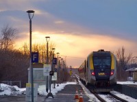 The sun is getting ready to set as VIA 39 departs Dorval Station.