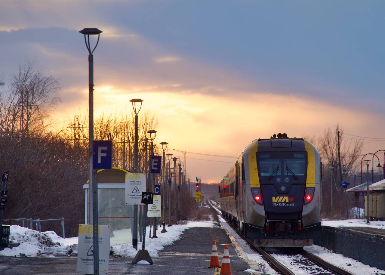 The sun is getting ready to set as VIA 39 departs Dorval Station.