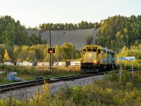 RS 65 leads the Laterrière turn down to Port-Alfred at UGB Est Junction on a nice sunny evening. This was the last train of the day for me. In the background we can see an ATV going down the sandy hill. These ATVs and sometimes motorbikes goes up and down the hill all day long during the summer months, these along with the military jet planes from the Bagotville AFB and the dogs barking in the nearby park makes this spot a pretty noisy one... But atleast each time the train comes around, especially the Arvida bound ones, it drowns all of the other noises right away!