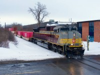Fourty minutes after shooting the Lackawanna heritage unit leading CN 529, I am high up on a snowbank to photograph CP 7018 leading CPKC 2114 as it approaches Lachine IMS Yard.