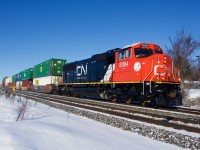 CN 8364 (which I believe is the highest numbered SD75IACC in service at present) leads a late CN 120 through Pincourt on a clear morning.