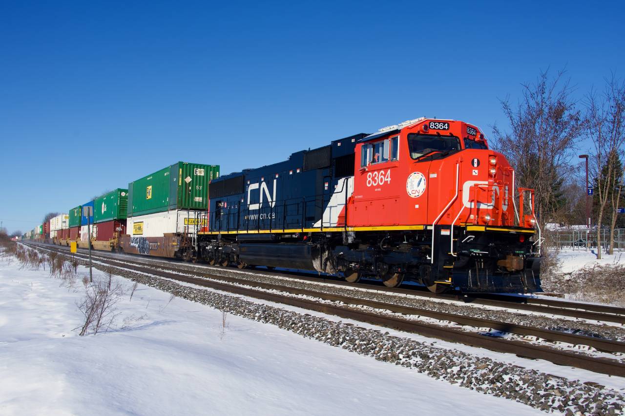 CN 8364 (which I believe is the highest numbered SD75IACC in service at present) leads a late CN 120 through Pincourt on a clear morning.