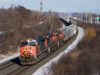 CN 369 has a trio of ES44DCs as it rounds a curve in Beaconsfield.