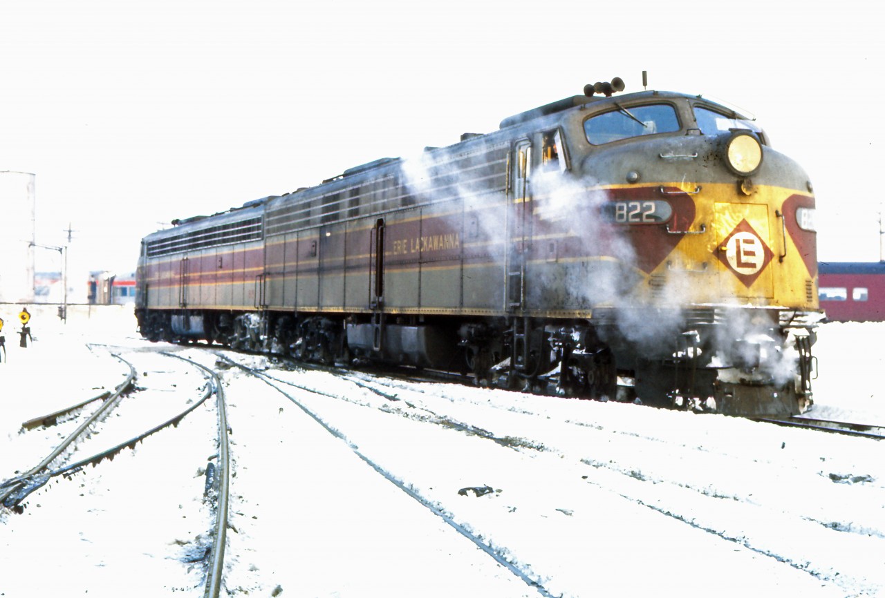 Having arrived at Windsor station on the Montreal Limited perhaps 30 minutes earlier, a pair of Erie Lackawanna E8As move in The Glen yard, CP's passenger servicing facility in Westmount. The engines seem to have already been turned on the loop since the 822 is the lead unit on this train in another December 1969 photo by D W Clark (https://www.railpictures.ca/?attachment_id=58703). The engines and cars will head back to New York on tonight's Montreal Limited, departing at 9:30 PM. Both the overnight and daytime D&H trains will be cancelled at Amtrak's start-up on May 1, 1971. (GPS location is approximate.)