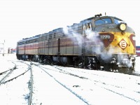 Having arrived at Windsor station on the Montreal Limited perhaps 30 minutes earlier, a pair of Erie Lackawanna E8As move in The Glen yard, CP's passenger servicing facility in Westmount. The engines seem to have already been turned on the loop since the 822 is the lead unit on this train in another December 1969 photo by D W Clark (https://www.railpictures.ca/?attachment_id=58703). The engines and cars will head back to New York on tonight's Montreal Limited, departing at 9:30 PM. Both the overnight and daytime D&H trains will be cancelled at Amtrak's start-up on May 1, 1971. (GPS location is approximate.)