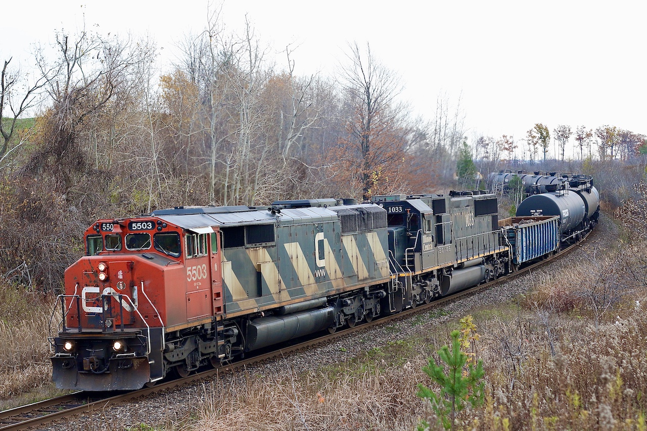 CN once had a decent variety of six axle cowl units, by the late 1990’s the small fleet of Bombardier HR616’s were gone. Then the 2000’s would claim the somewhat troublesome SD50F’s. The SD60F fleet along with the handful of demonstrator  SD50AF’s would soldier on through the 2010’s until being displaced by a large group of second hand standard cab ex Oakway SD60’s. This would leave CN’s Dash-8 cowls as the last Drapers on the roster until their retirement. The four demonstrator SD50AF’s 5500-5503 were unique as they were basically SD60F’s internally in a SD50F body. This day SD50AF 5503 was leading train 382 along with an IC SD70. By this time 5503 was running short on years remaining on CN’s roster and showing its age with damaged grills, replacement hood door and a good coat of weathering. Today the CN’s variety of cowls is certainly missed by railfans.