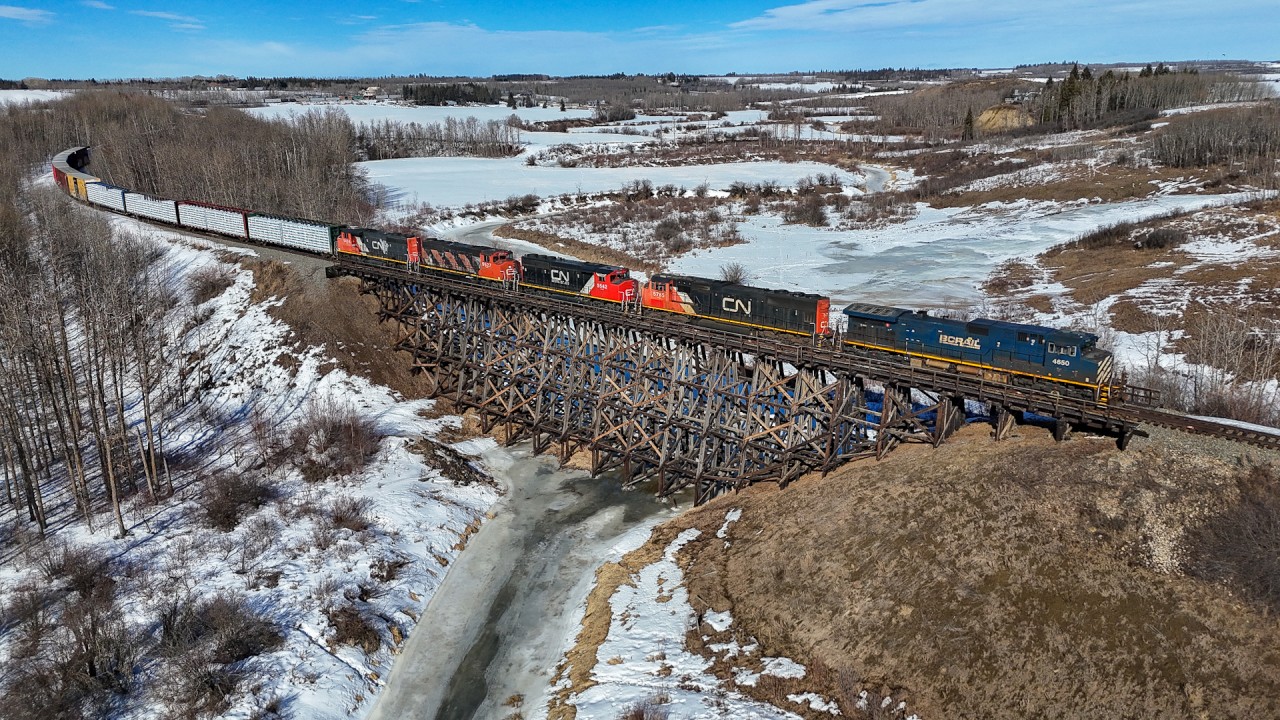The daily McLennan to Edmonton Manifest crosses the Sturgeon River with BCOL 4650, CN 5785, CN 9424, CN 9527 and CN 9542.  The GP40-2W are based at Roma Junction and run daily on the Manning and Meander River Subs.  They are enroute to Walker LRC for servicing and will head back north in a few days.