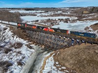 The daily McLennan to Edmonton Manifest crosses the Sturgeon River with BCOL 4650, CN 5785, CN 9424, CN 9527 and CN 9542.  The GP40-2W are based at Roma Junction and run daily on the Manning and Meander River Subs.  They are enroute to Walker LRC for servicing and will head back north in a few days.  