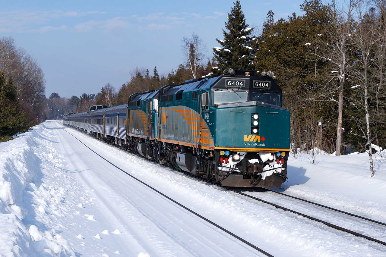 Running about 6 hours late (a CN breakdown caused a nightmarish crew change in Gogama) VIA 2 heads for a stop in Parry Sound....where it will get hooped for another 45 minutes for a northbound stacker. While the treatment it gets is deplorable, there is nothing better looking on the rails anywhere.