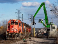 When the 1600 Yard Job arrived in Strathearne Yard, AIM got on the radio telling CN they had more load for them tonight, and the crew decided it was easiest to just go there themselves. Something you don't get to see all that much (AIM shuffles cars themselves between their facility and Strathearne Yard). 