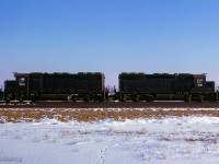 EMD SD40X demonstrators 7000 and 7001 are seen at CPR's Agincourt yard with dynamometer car 62, on the head of a freight from Calgary.  Temporarily renumbered while testing on CP, the units were built in 1965 as EMDX 434D (7000), and 434C (7001), part of a set of 8 units; 434A - 434H, sold to UP in 1966.

<br><br><i>Scan and editing by Jacob Patterson.</i>

<br><br><i>Another view by Doug Hately <a href=https://www.railpictures.ca/?attachment_id=24239>HERE</a>