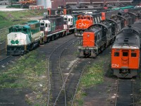 An assortment of power rests at CN's Spadina engine facility.  From left, GO Transit 9808, 9806, 9804, 980x, 9810, 980x, CN 9434, 5535, 4102, 8031, 1244, 1252, 125x, 1248, 6203.

<br><br><i>Scan and editing by Jacob Patterson.</i>