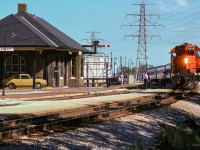 The operator is out on the platform at St. Clair Avenue, passing orders to the crew of train 169, the "Barrie Bullet."  The usual assortment of heavyweight equipment makes up the consist.

<br><br><i>Scan and editing by Jacob Patterson.</i>