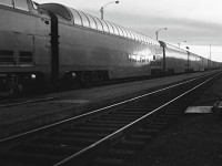 Back in 1964, CN purchased 4 full length dome cars from the Milwaukee Road. They are shown in Capreol, Ontario, marshalled ahead of the caboose, heading west to Transcona Shops in Winnipeg for refurbishing.