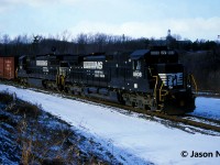 Norfolk Southern train 328 is viewed having just entered the cowpath at Hamilton West, Ontario as it completed its eastbound trip over the CN Dundas Subdivision and is now heading for the Grimsby Subdivision. Powering 328 are Dash 9-40C 8808 and Dash 8-40C 8747.

